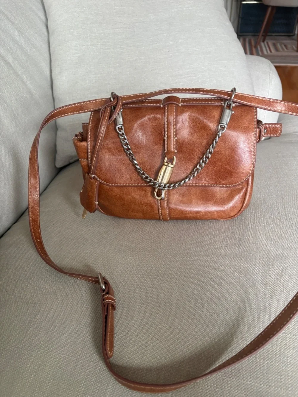 CHARLES & KEITH Delfina Chain Crossbody Bag in Distressed Tan